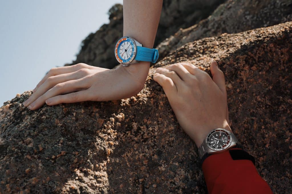 2 modeller fra kolleksjonen Certina DS-X på damearm og herrearm på en fjellknaus